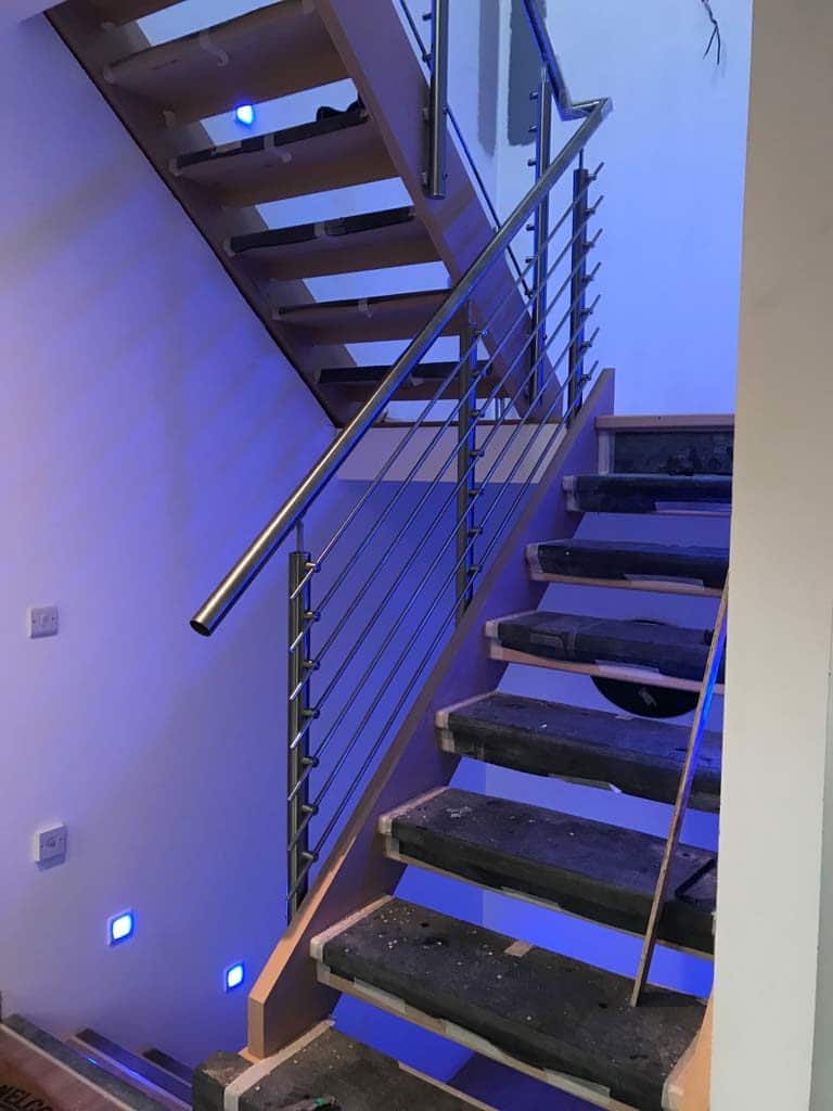 stairwell with metal handrails